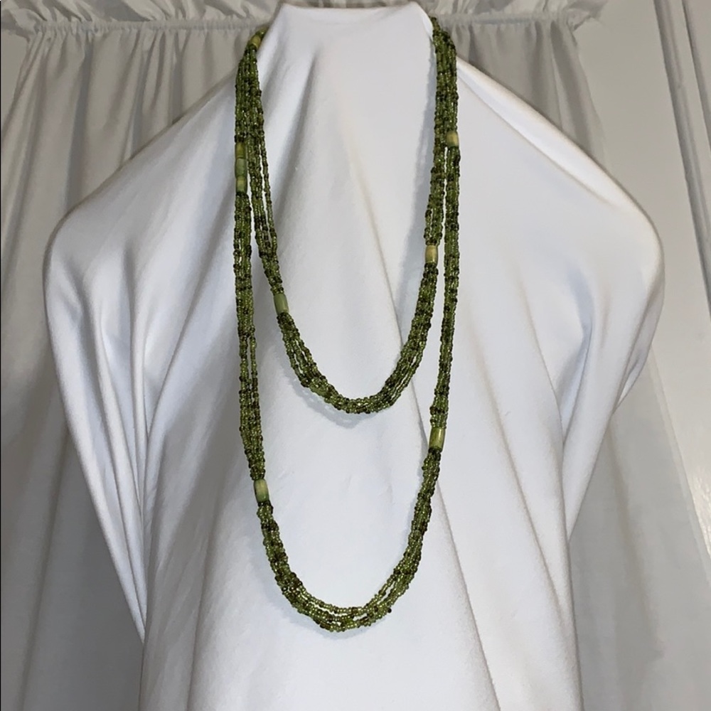 Green beaded necklace can be worn multiple ways.